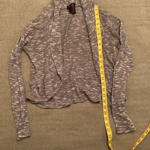 Grey small knit top jacket without buttons in excellent condition. Worn w/ TLC.